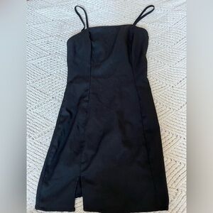 Black silk dress with a cut on the bottom